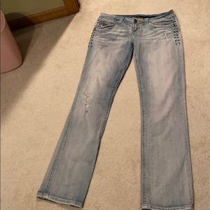 MEK voyage distressed light wash jeans with rips